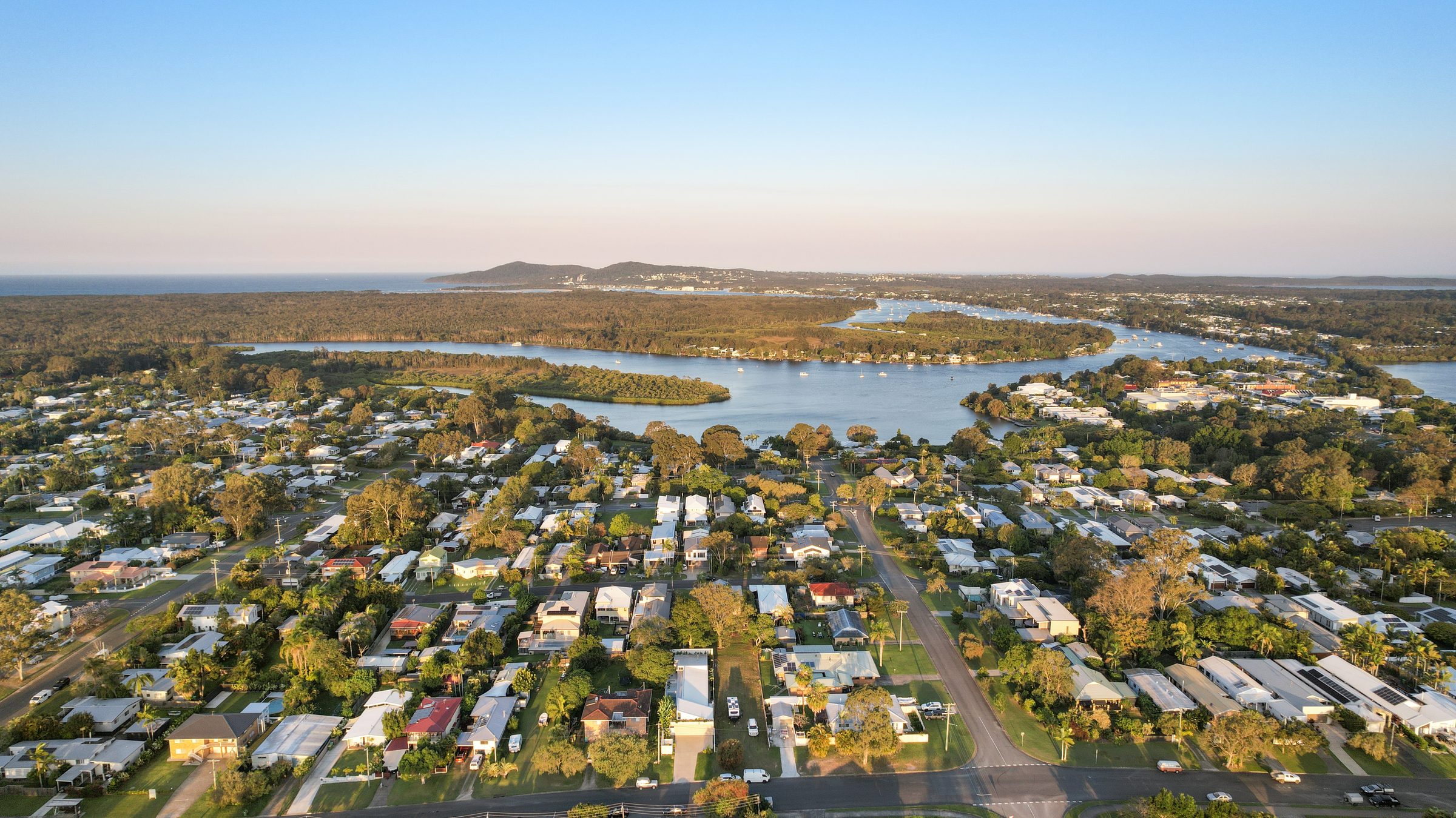 Aerial view across the suburb to the river