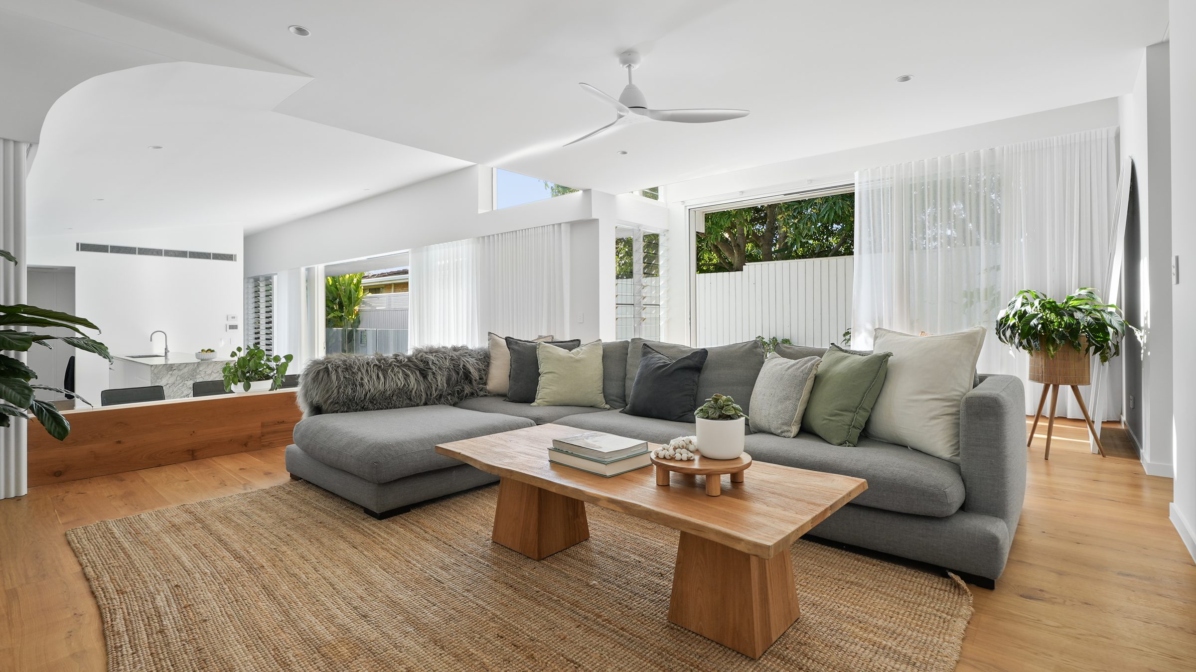 Living room with sectional sofa and jute rug